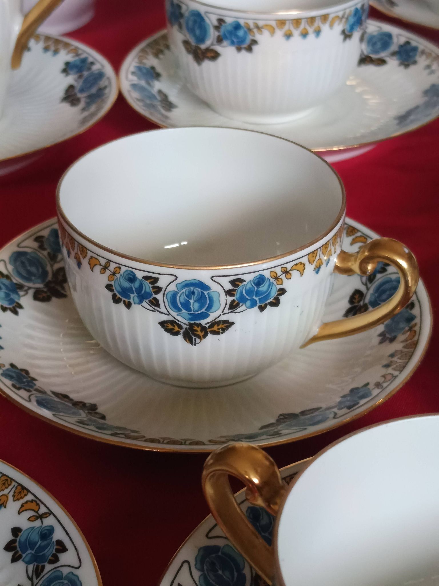 Antique Limoges porcelain coffee/tea service – 14 pieces with blue rose decoration.