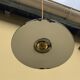 Vintage industrial enameled sheet metal pendant lights with golden wires, old green and white lampshade