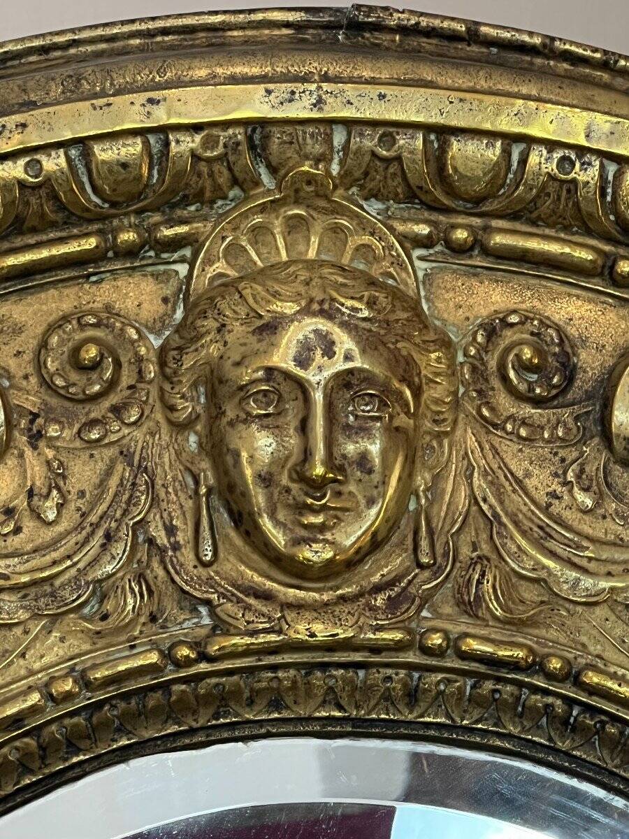 A. Arens, Antwerp, important oval mirror in repoussé brass with numerous animal decorations