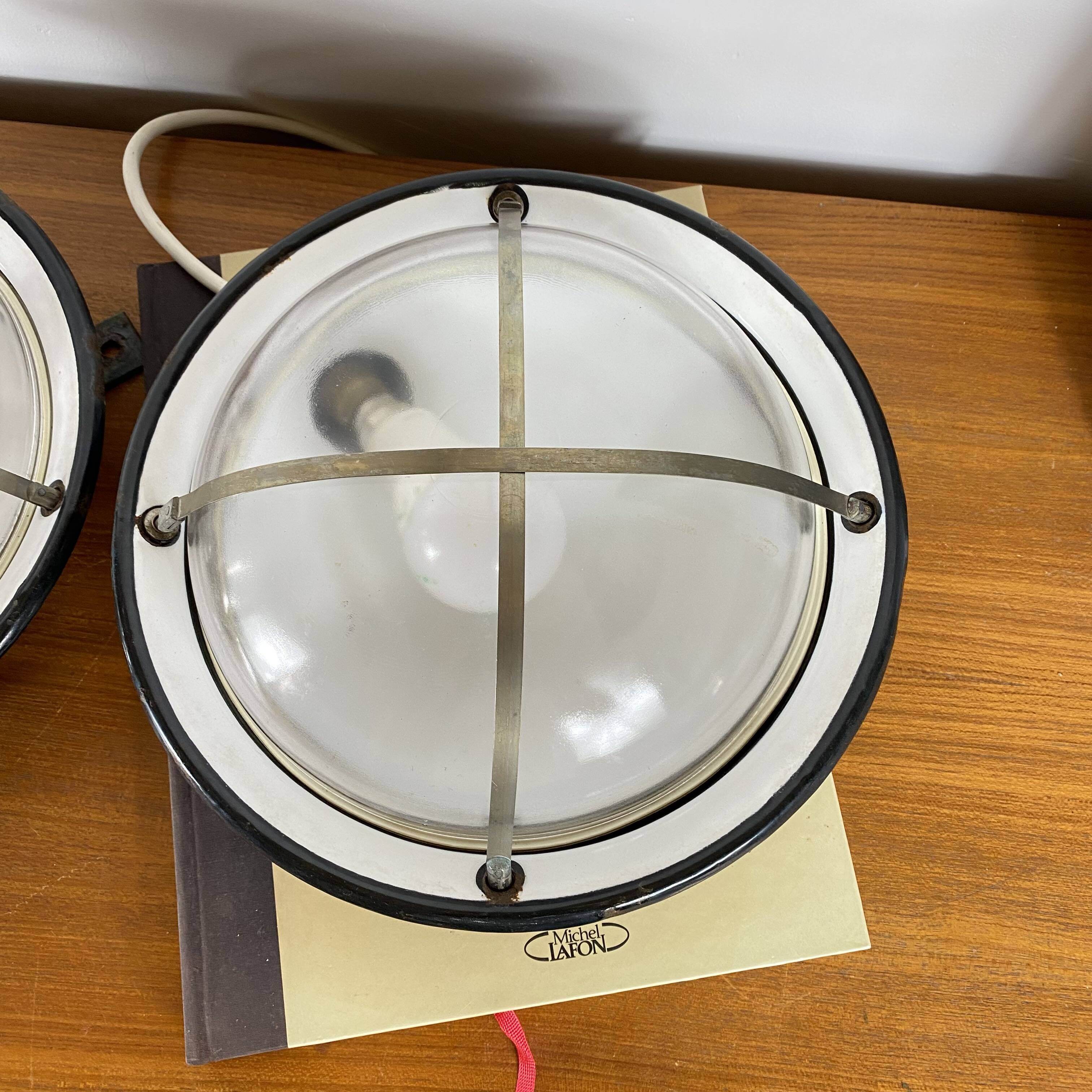 Pair of vintage industrial wall sconces or ceiling lights in enamelled sheet metal.