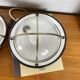 Pair of vintage industrial wall sconces or ceiling lights in enamelled sheet metal.