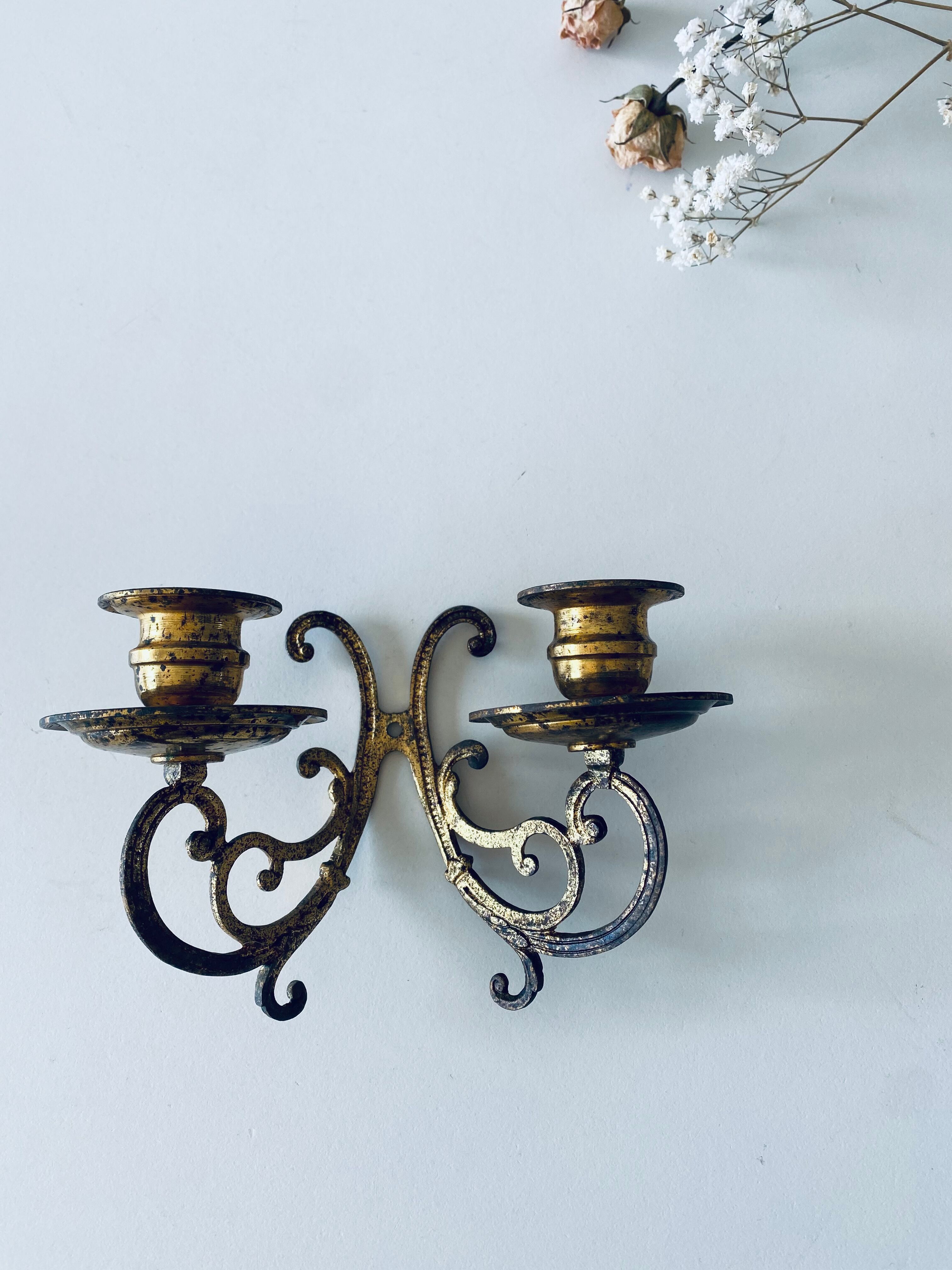 Old wall candle holder in golden brass