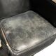 Pair of leather armchairs with marquetry armrests