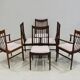 Set of six wooden dining chairs Arne Vodder Model No 422 with fabric upholstery.