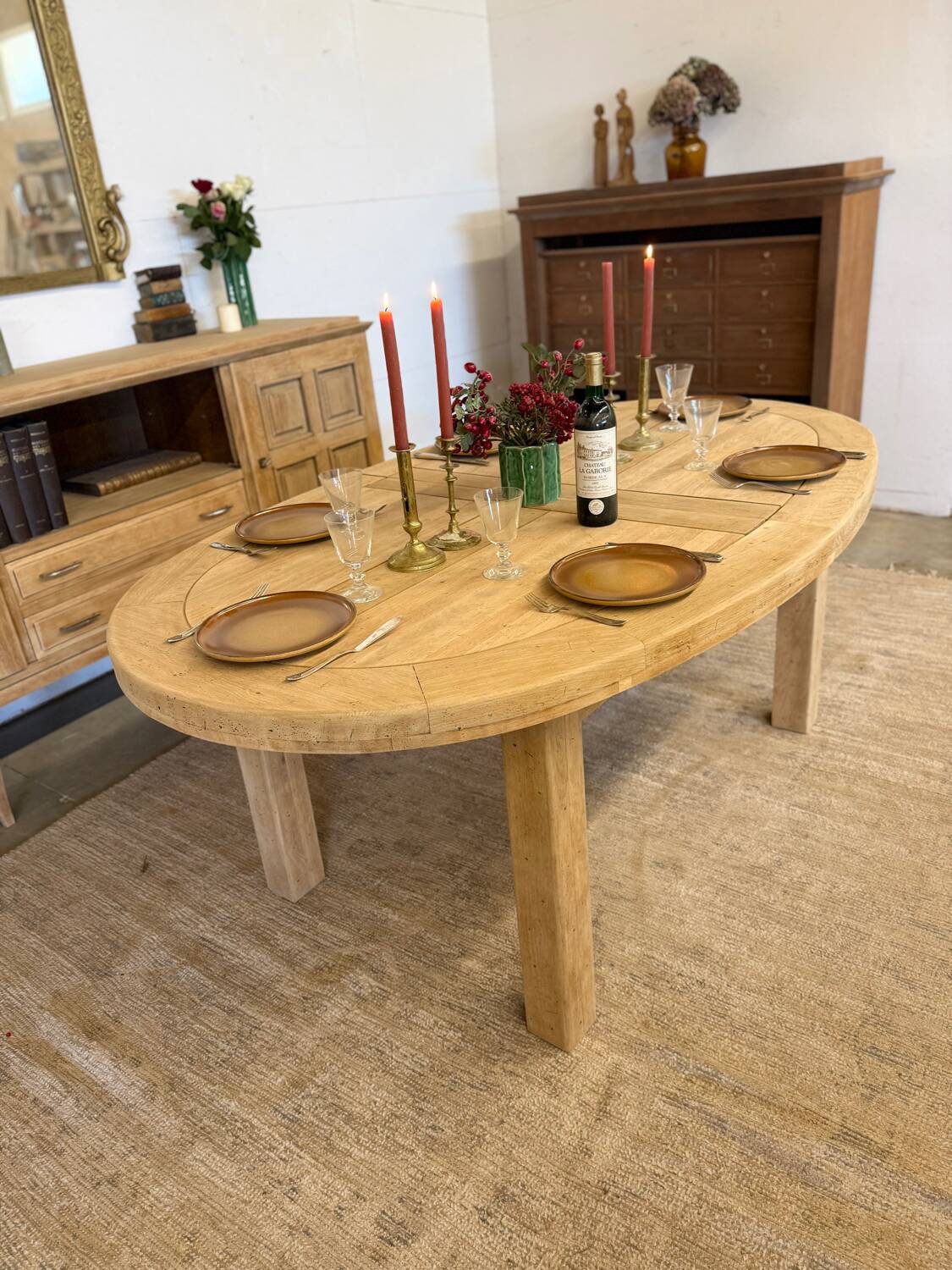 Oval farmhouse table in solid oak with extensions.
