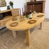 Oval farmhouse table in solid oak with extensions.