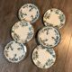 6 mismatched iron land dessert plates