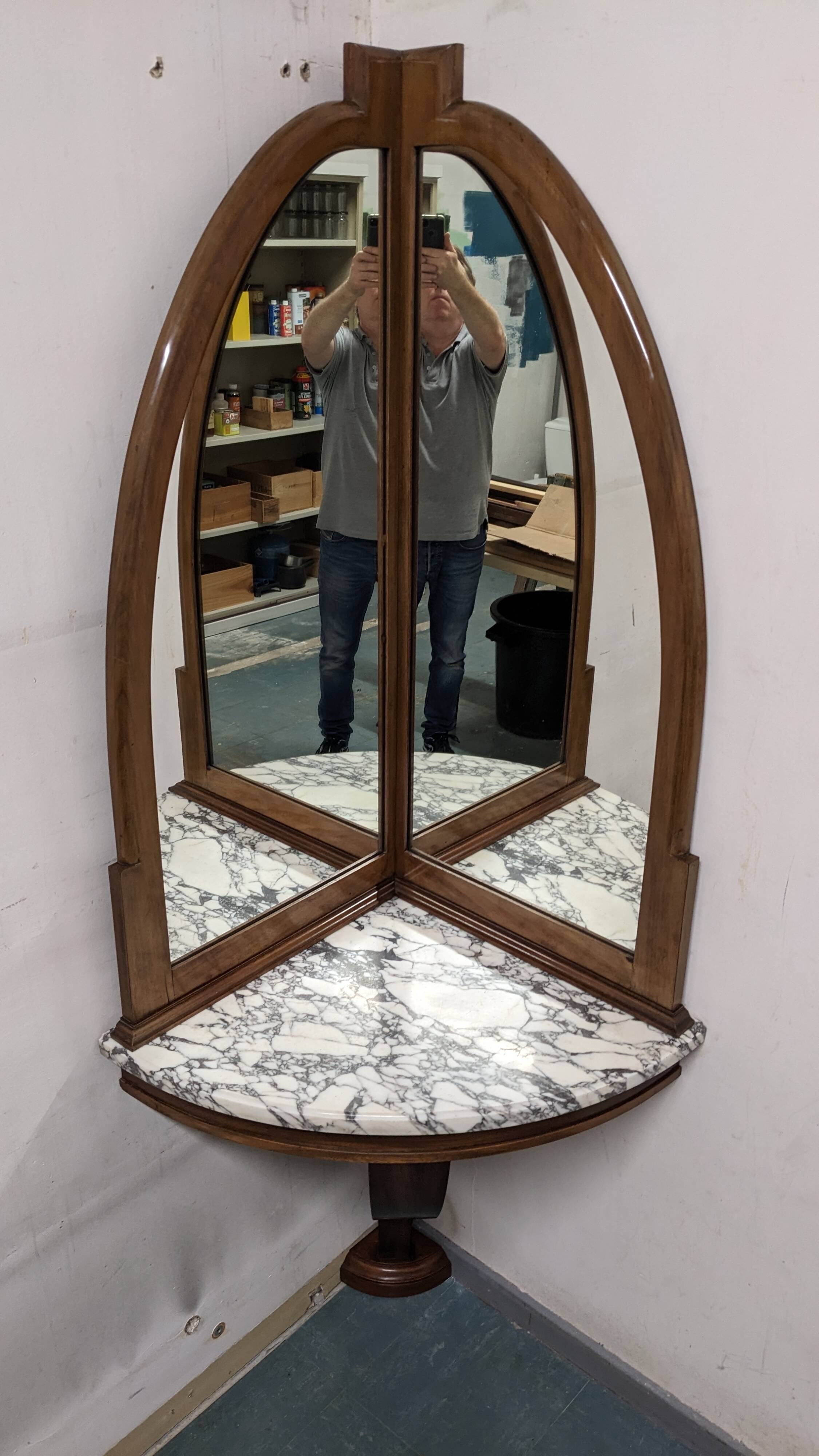 Console and its Art Deco corner mirror in walnut, France circa 1920.