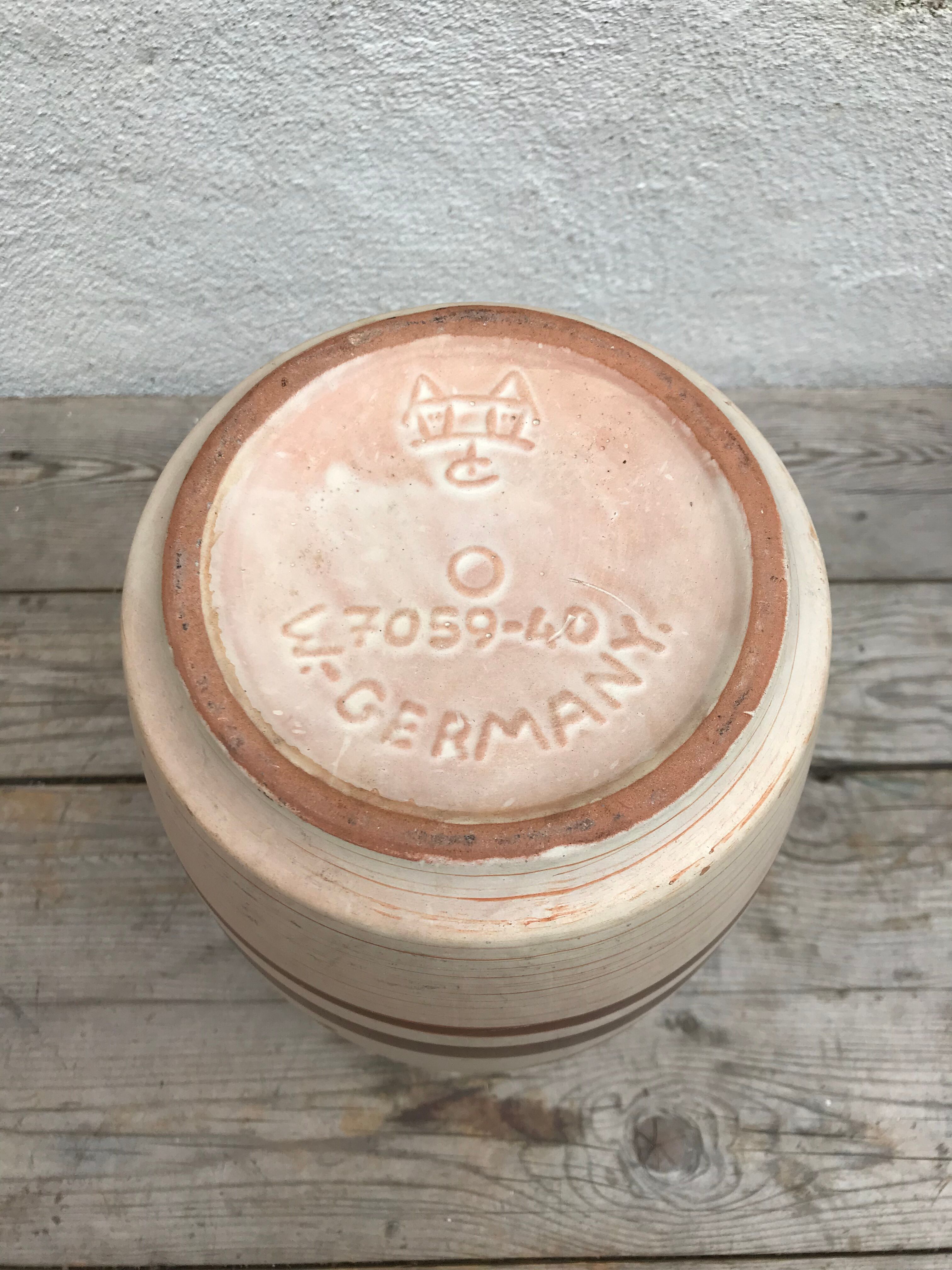 Antique beige ceramic vase with decorative painting