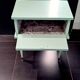 Vintage bedside table with compass feet