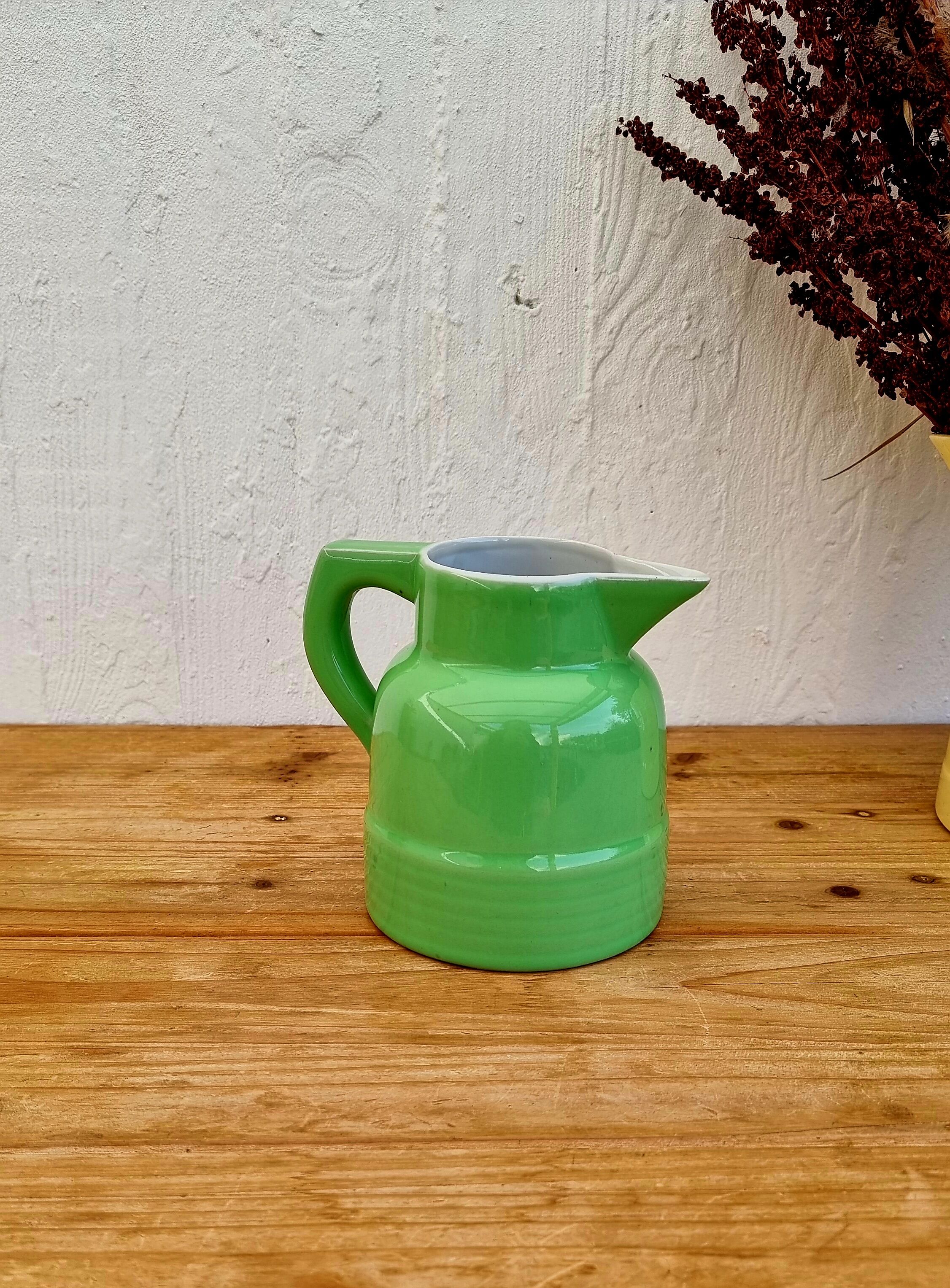 Vintage green earthenware pitcher