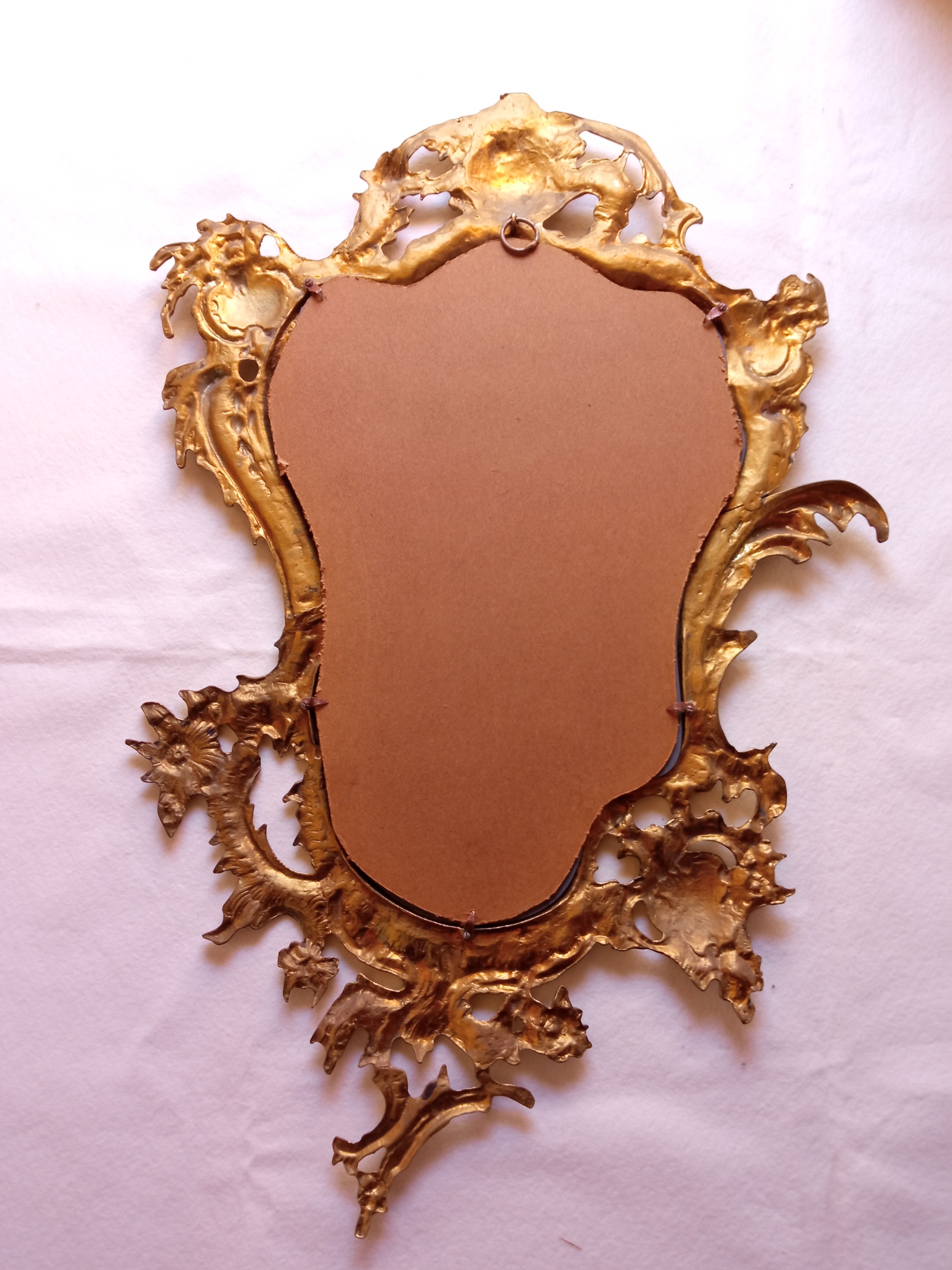 Antique mirror in gilded metal