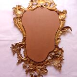 Antique mirror in gilded metal
