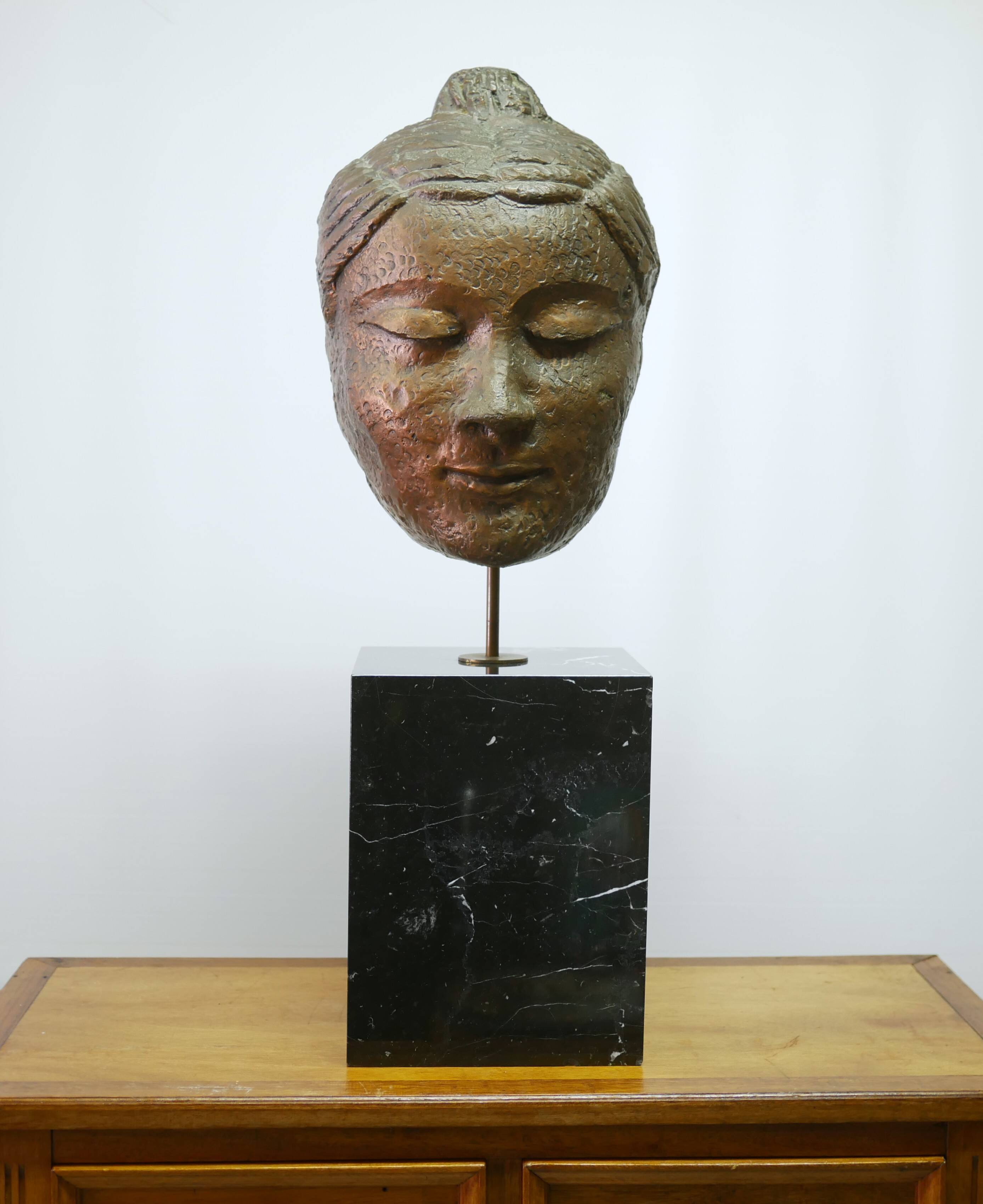 Buddha head sculpture, marble base