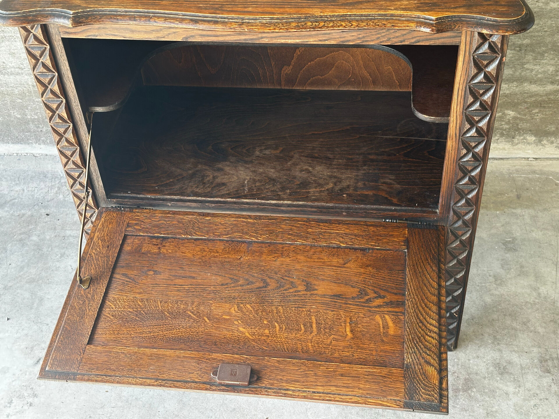 Small storage cabinet in carved oak – circa 1930