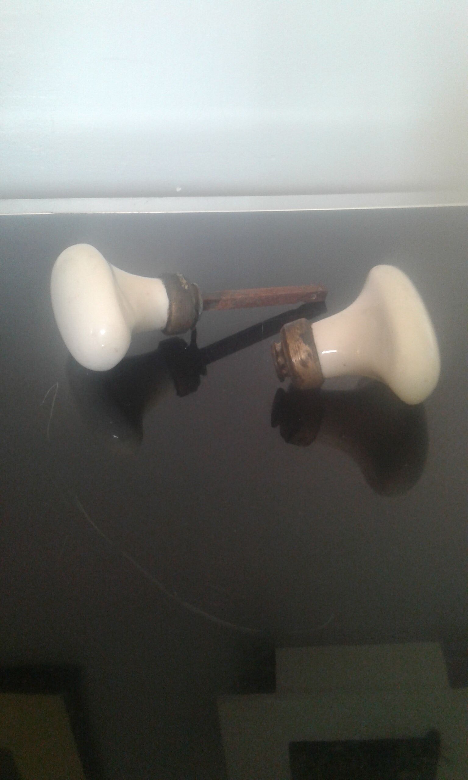 Old pair of porcelain door handles