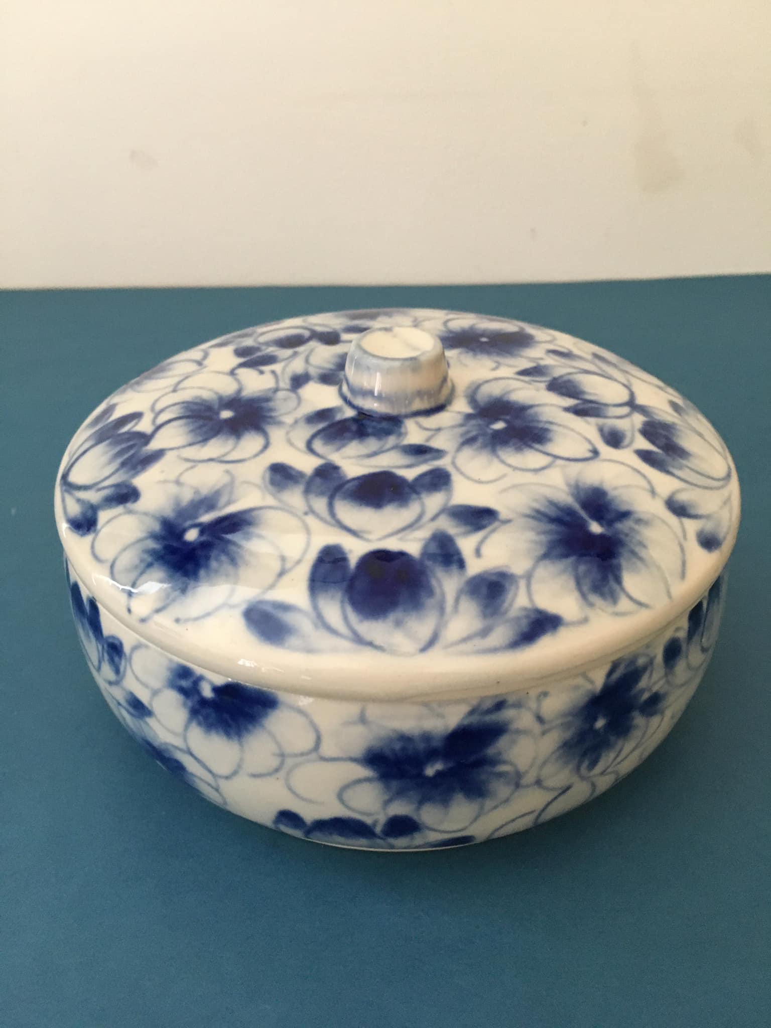 Porcelain candy dish. Blue flower patterns on white background