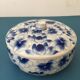 Porcelain candy dish. Blue flower patterns on white background