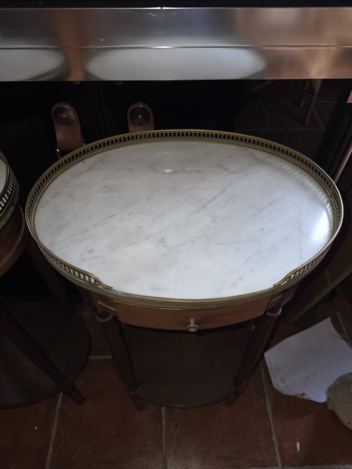 Pair of Louis XVI style bedside tables in mahogany, with marble tops.