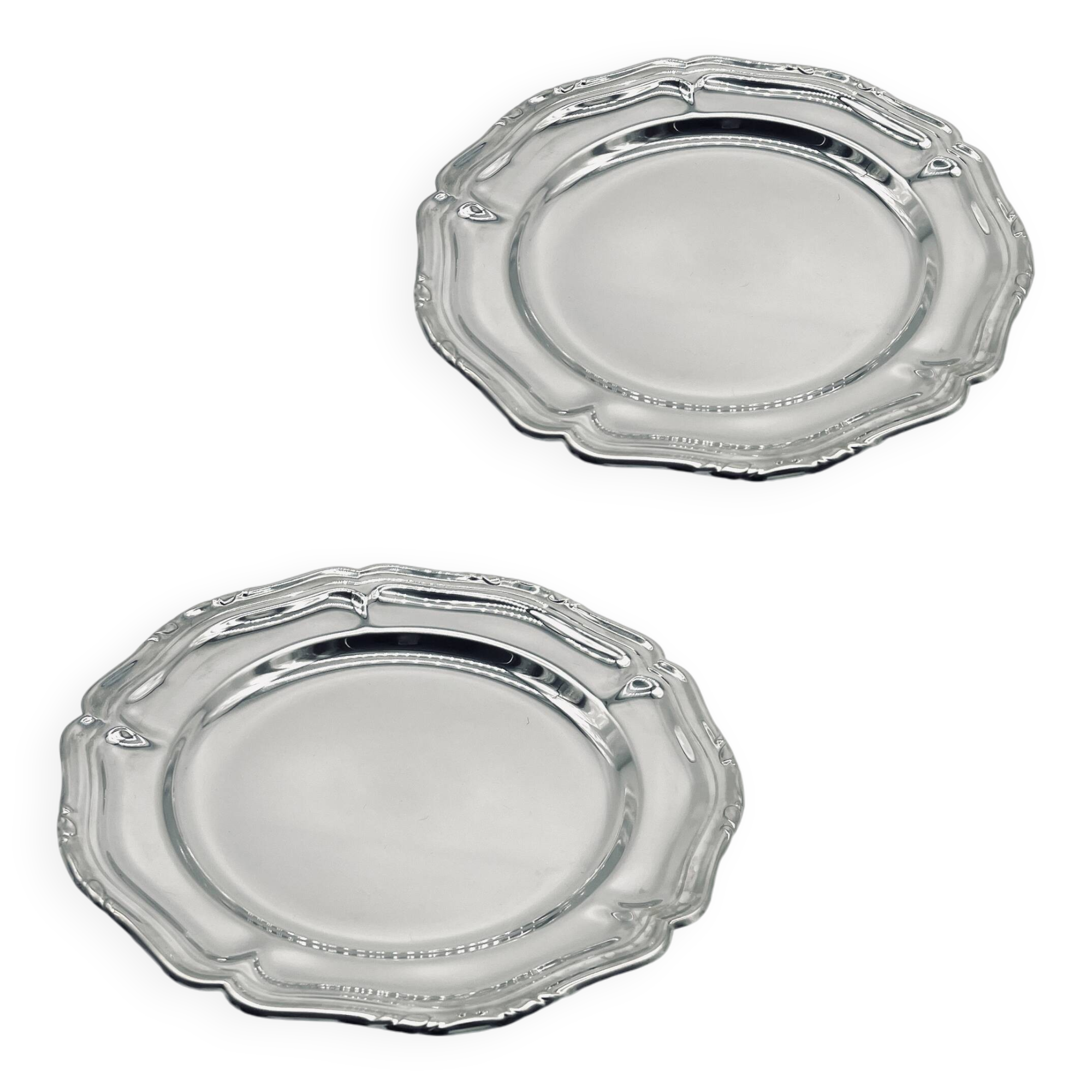 Two small stainless steel dishes