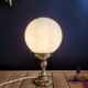 Lampe laiton globe Clichy
