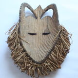 African mask with raffia and kaolin dots