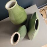 Trio of green enamelled vases