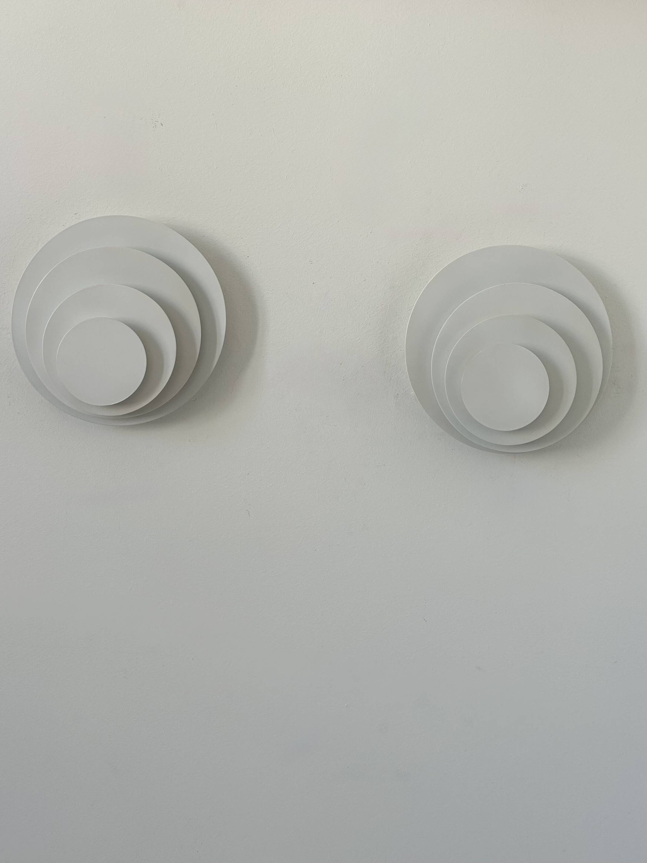 Pair of vintage wall lights, matte white metal, France, 1980.