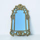 Large mirror with carved and gilded wooden frame, in Regency style.