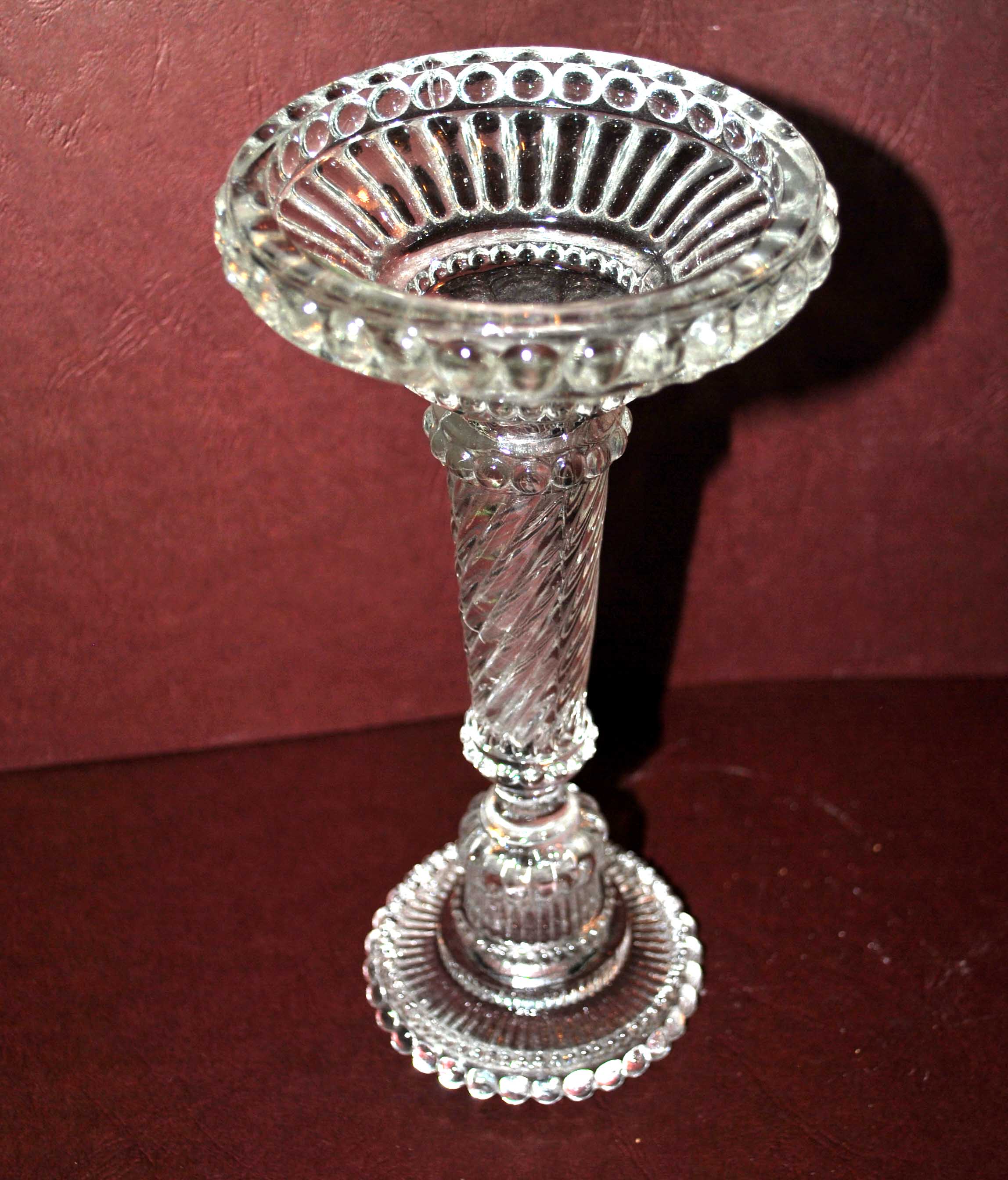 Old candlestick in molded glass of Portieux