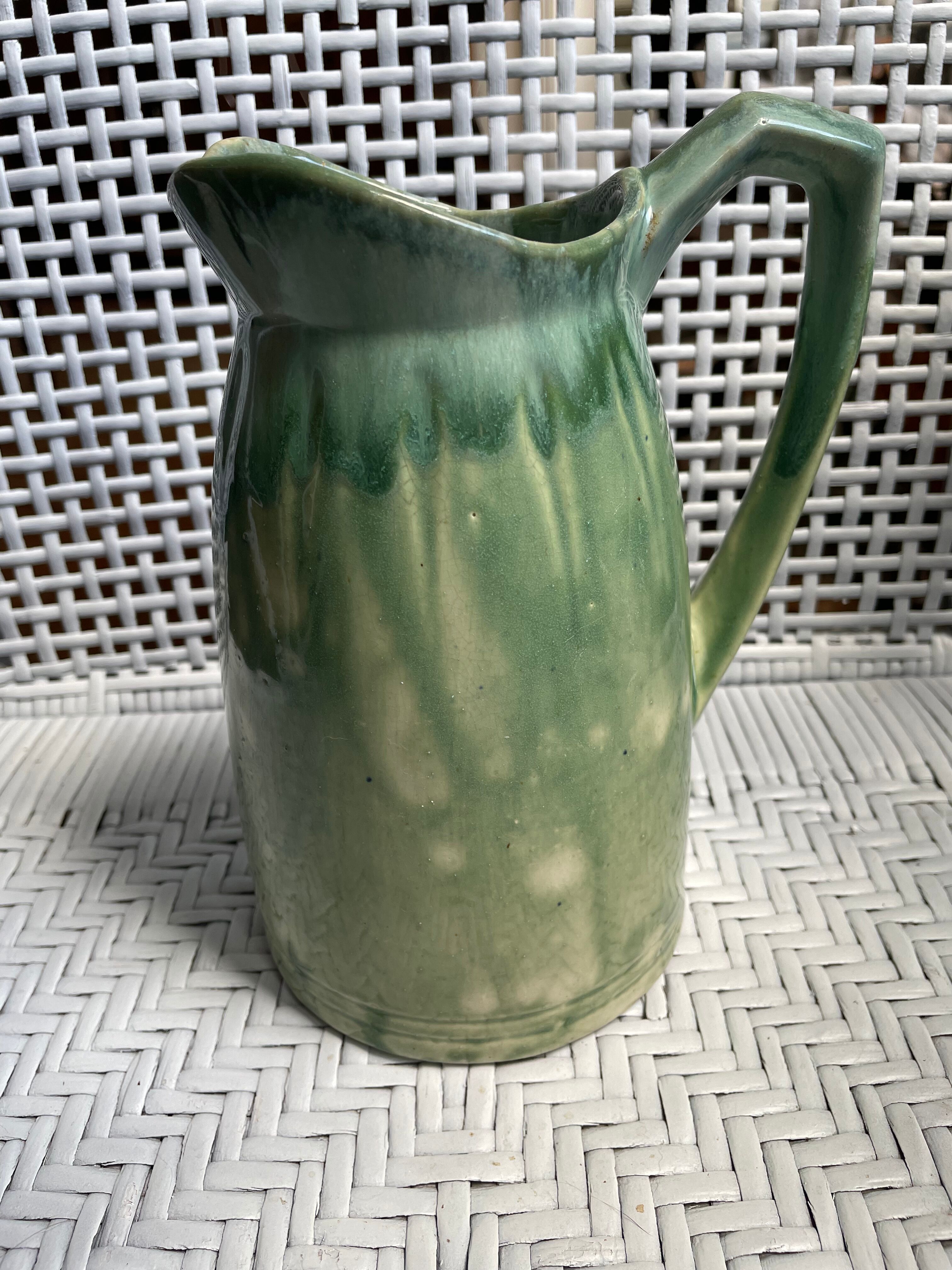Turquoise green enamelled ceramic pitcher