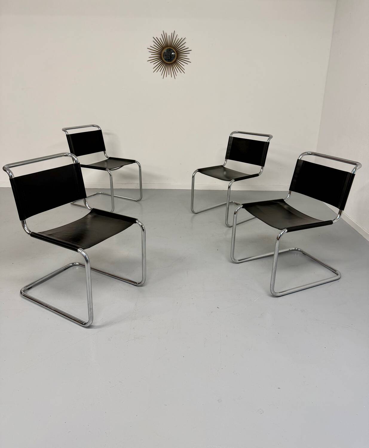 Lot of 4 tubular chairs designed by Mart Stam in vintage black leather from the 1980s.