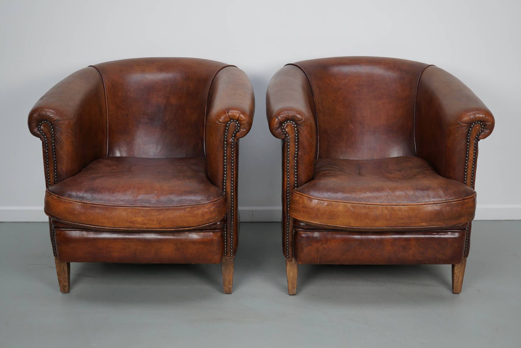 Vintage Dutch cognac coloured leather club chair, set of 2 with footstool