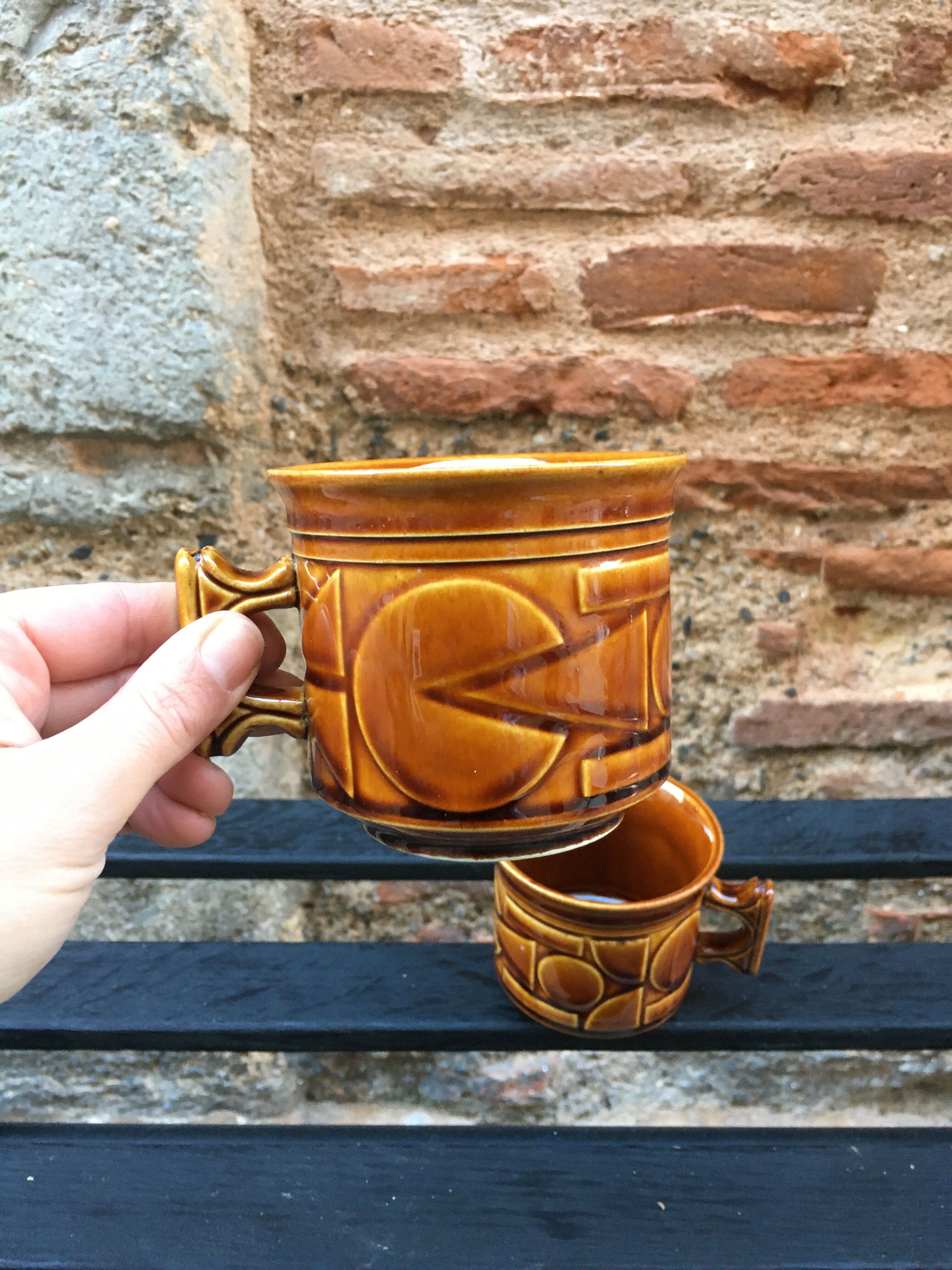 Two brown coffee cups