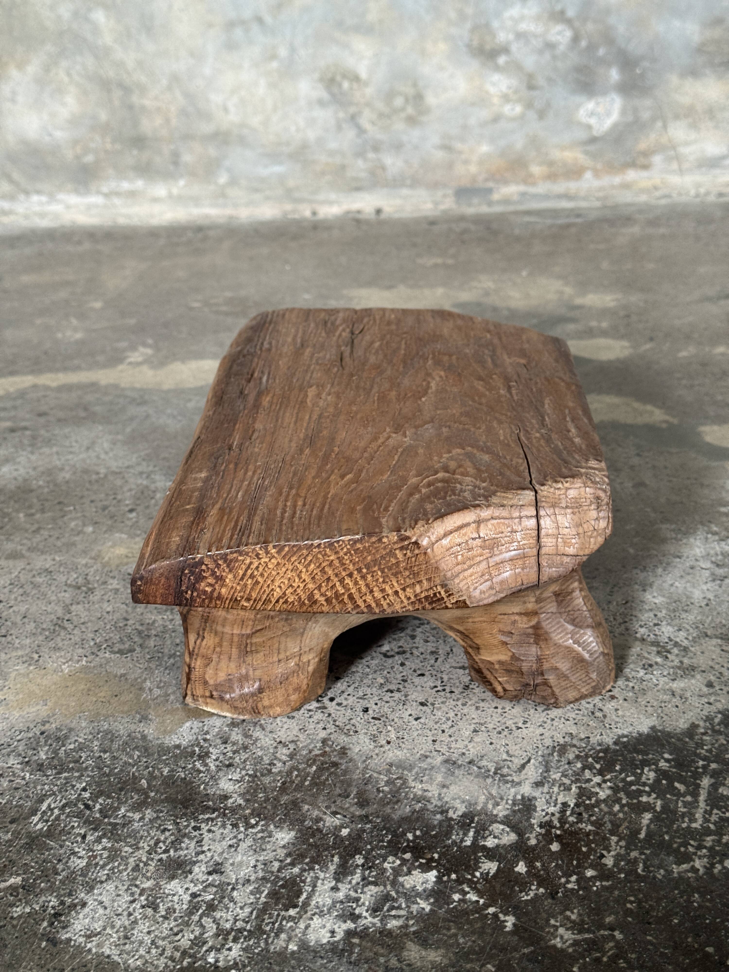 Small stool, teak footrest with short cut corners.