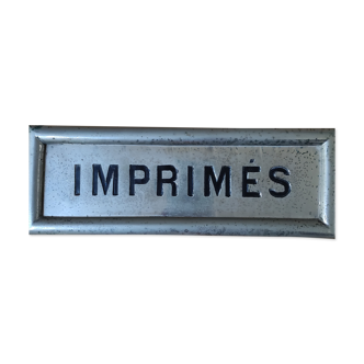 Sign "Printed"old. Silver metal.