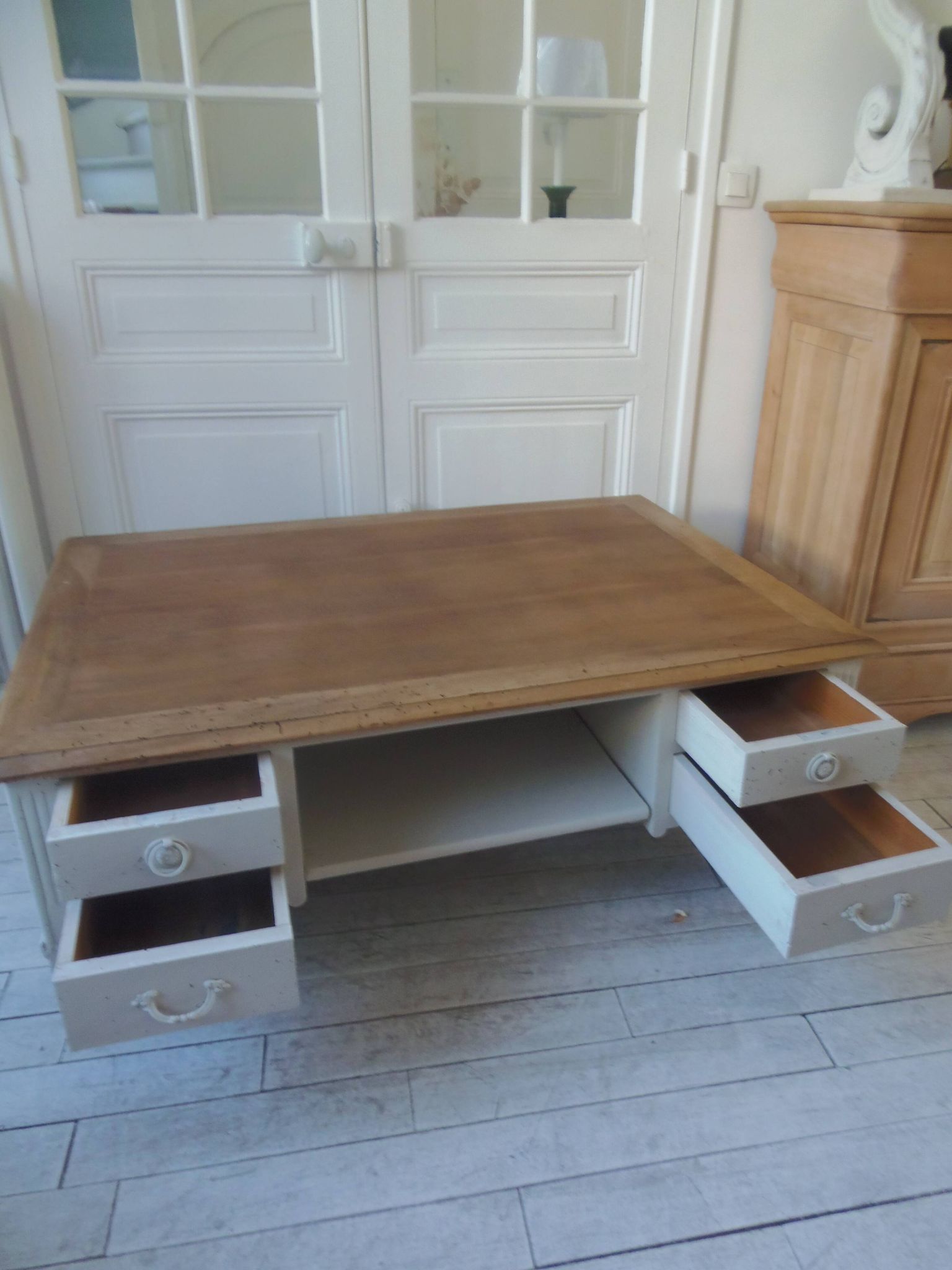 Coffee table on casters, made from an old desk, pearl gray base and belt.