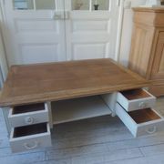 Coffee table on casters, made from an old desk, pearl gray base and belt.