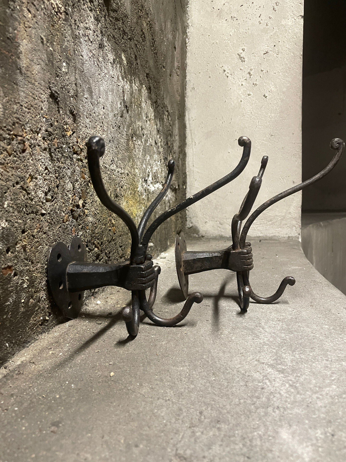 Brutalist pair of wall-mounted coat hooks.
