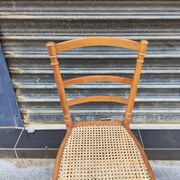 Antique wooden chair with cane seating