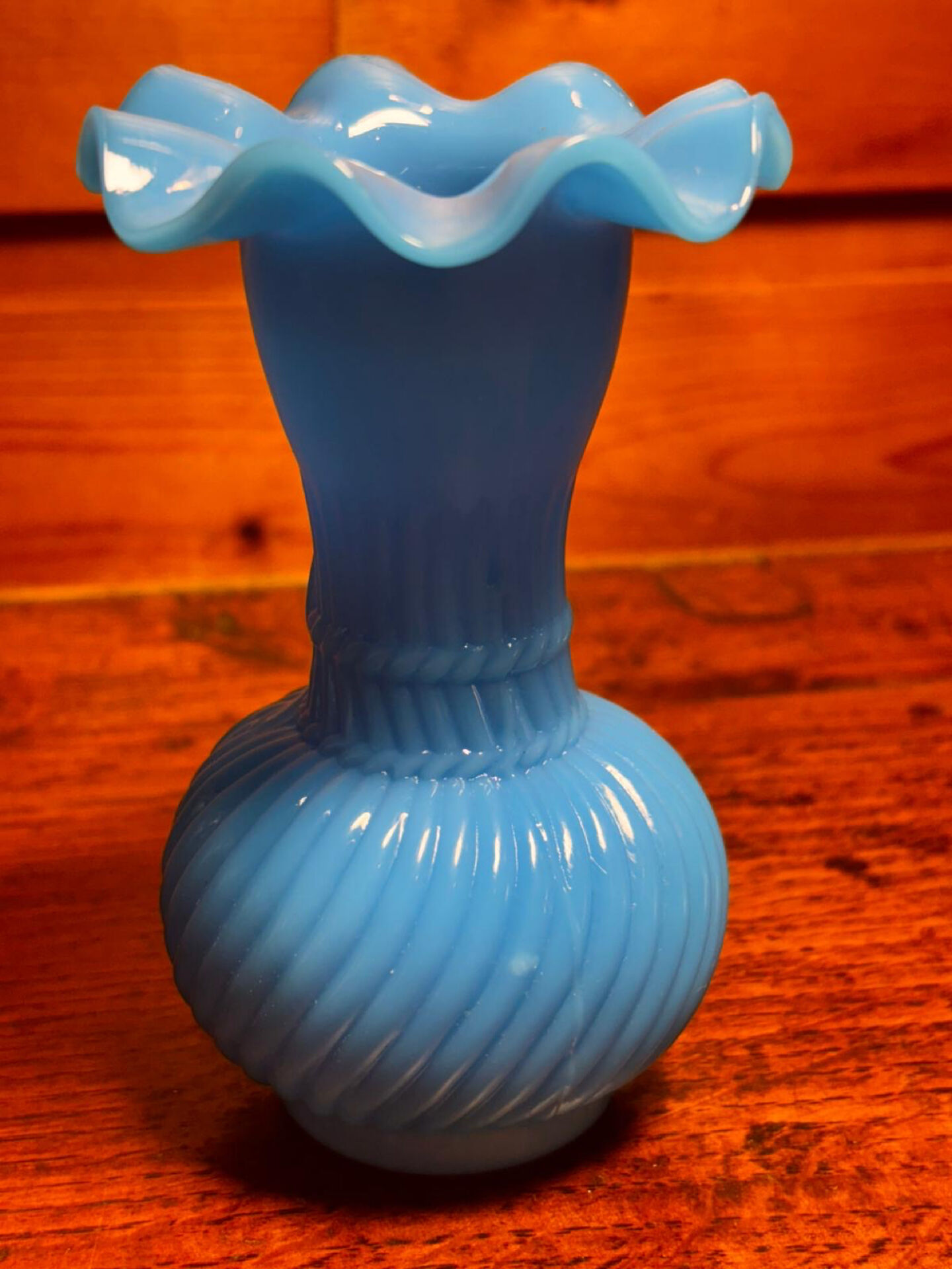 Blue opaline vase, opaque glass, wavy neck/rim, relief decoration of a bow.