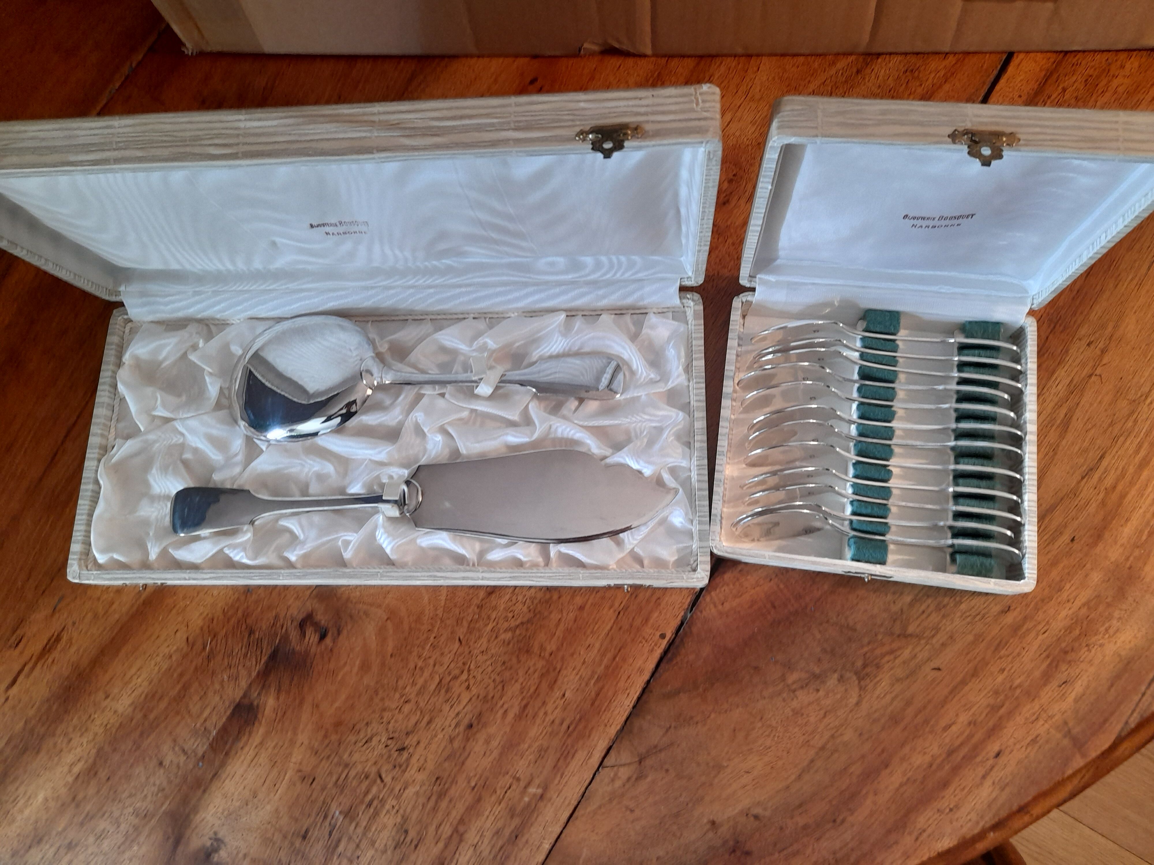 cutlery and spoons with ice and silver metal cake