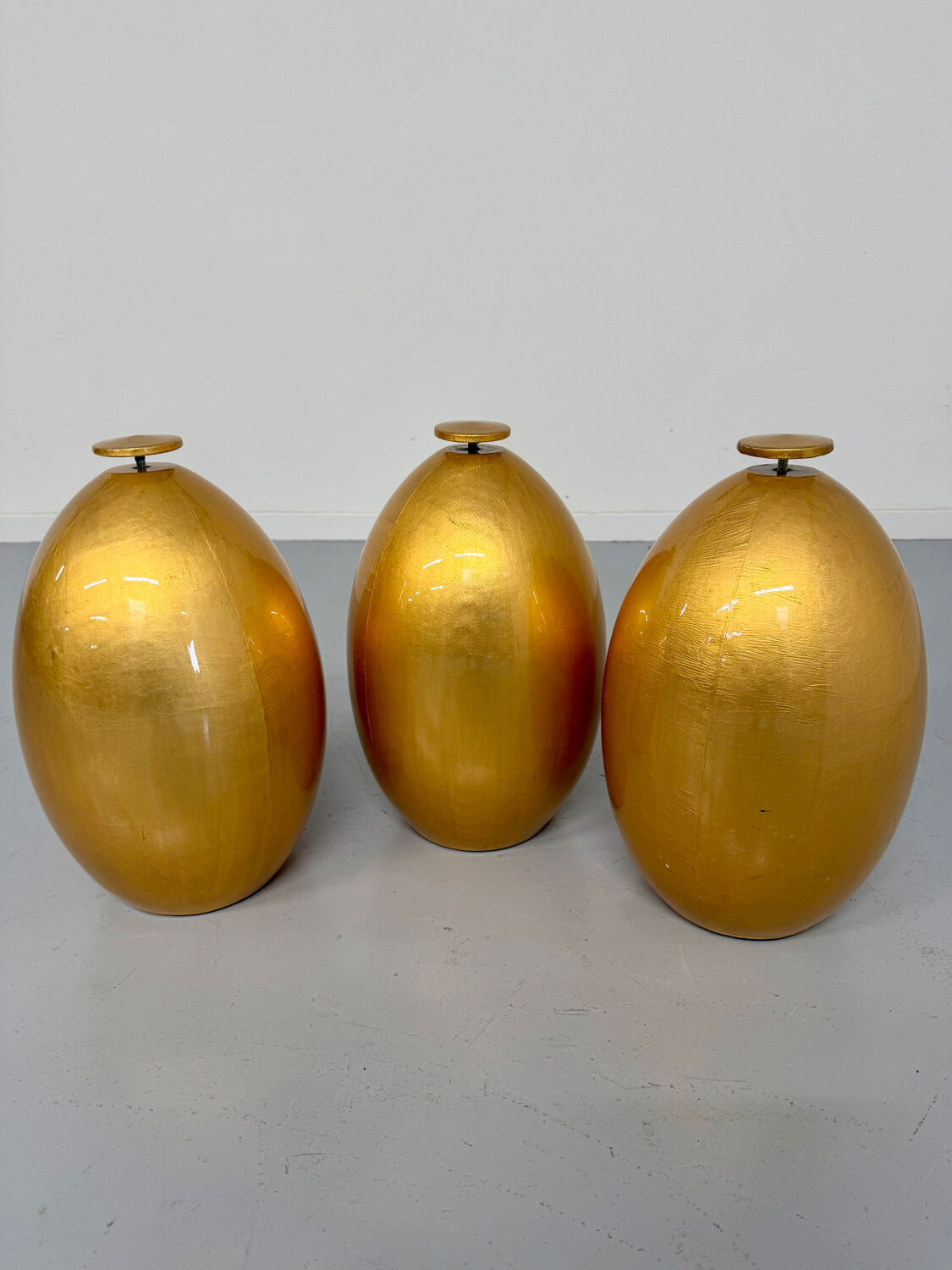 Vintage Italian design coffee table with a glass top and gold base, dating from the 1980s.