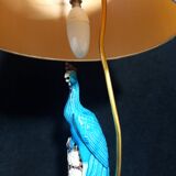 Large table lamp with earthenware peacock and beige silk lampshade