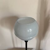Table lamp with a vintage powder blue globe and a black base