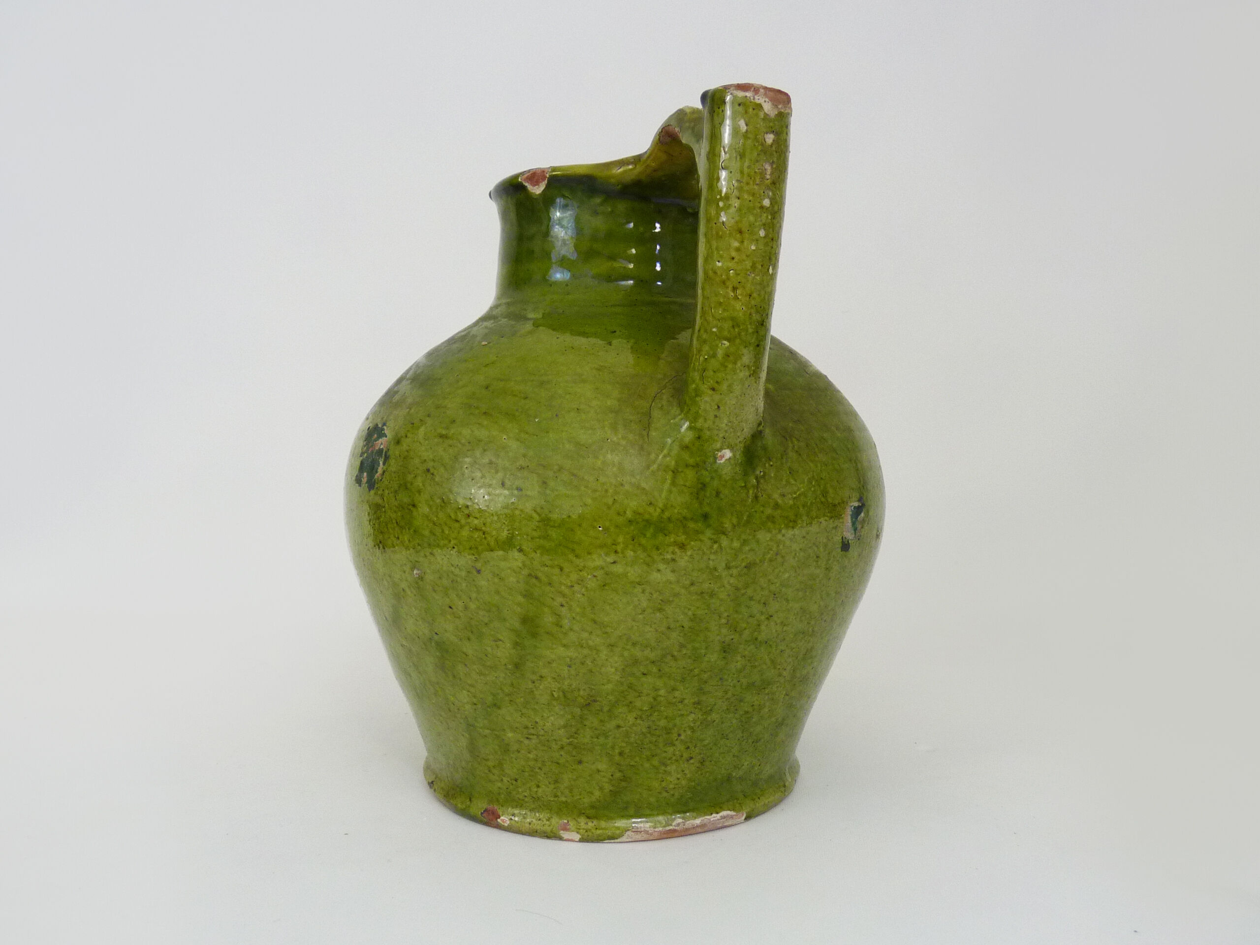 Orjol water pitcher pottery in green glazed terracotta. Pyrenees XIXth