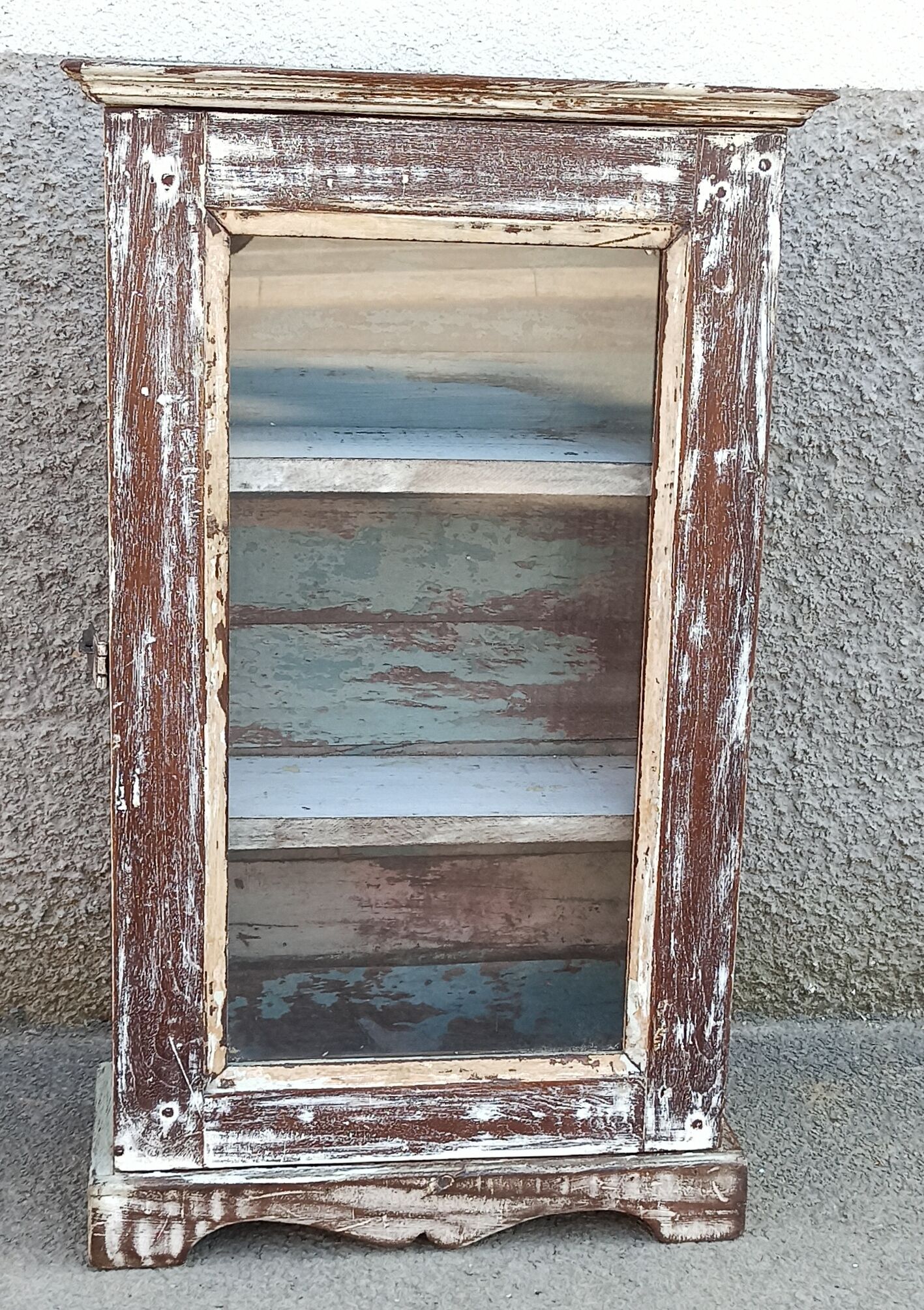 Old small wooden wardrobe with glass door