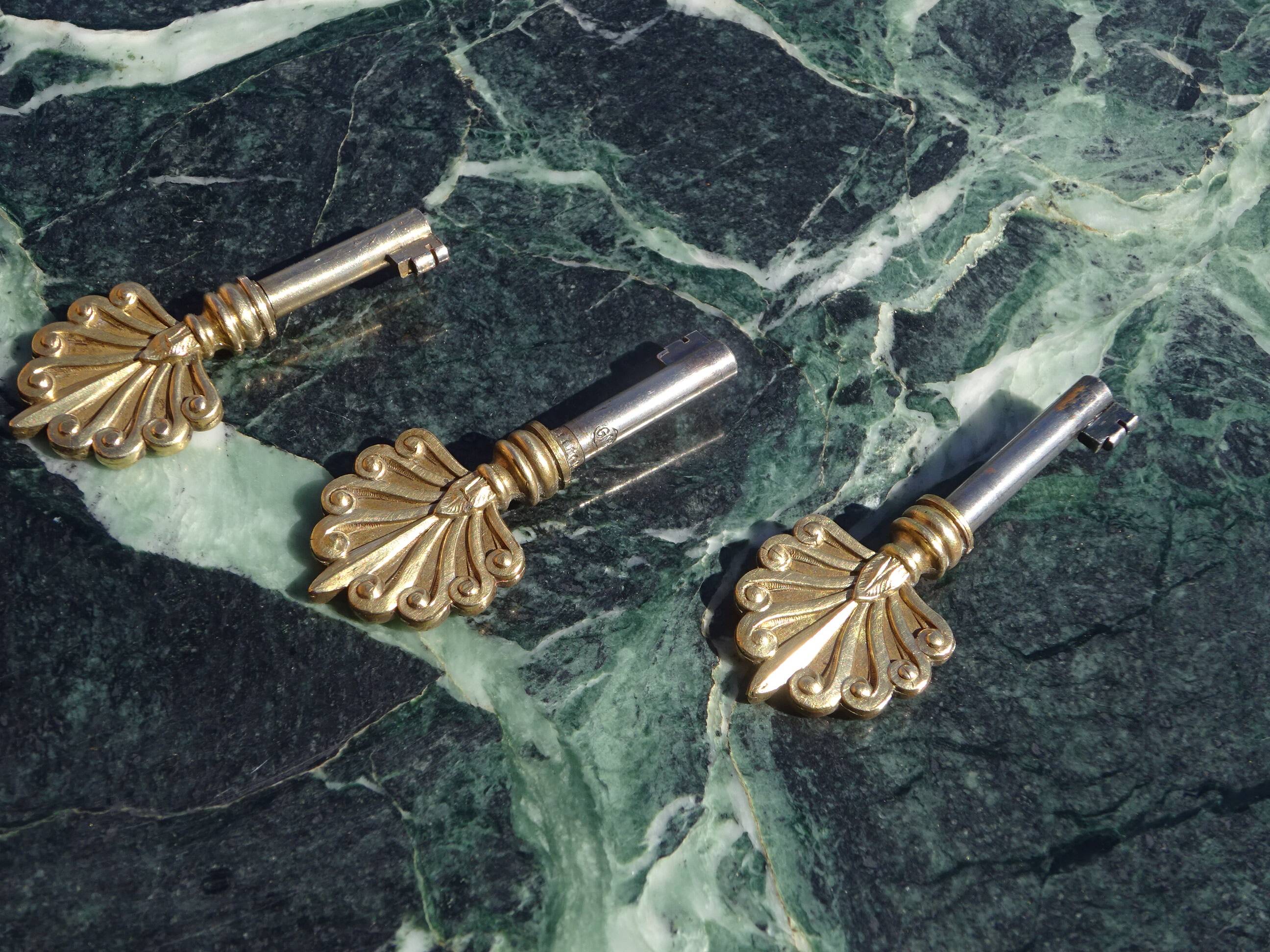 Flamed mahogany enfilade with sea green marble in Empire style.