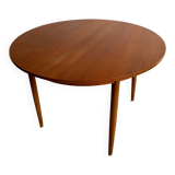 Vintage Scandinavian round table from the 50s and 60s in extendable teak with ra.