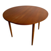 Vintage Scandinavian round table from the 50s and 60s in extendable teak with ra.